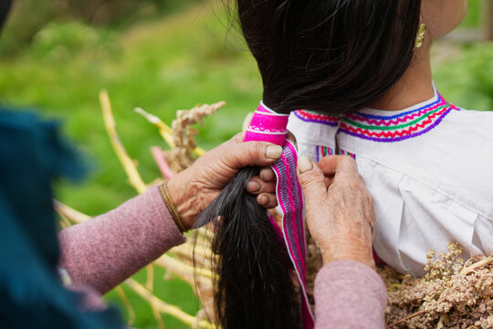 Puruwa woman with traditional clothing and braid