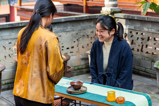 Traditional tea ceremony with two women interacting