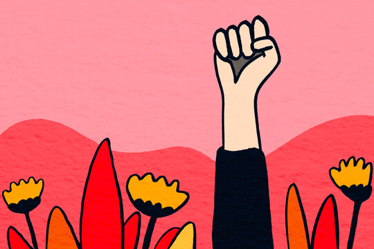 Hand raised in gesture amidst vibrant flowers