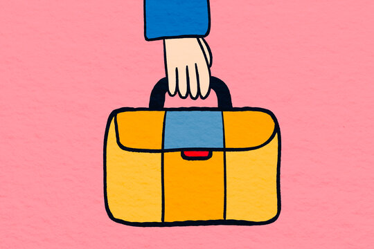 Hand holding a colorful bag with a pink background