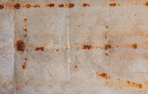 Rusty concrete surface with geometric patterns