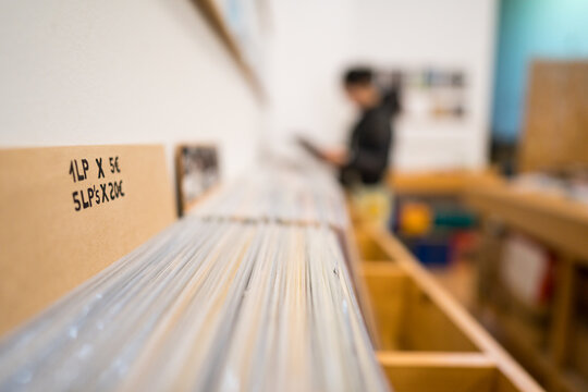Exploring vinyl records in a second-hand music store