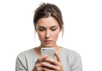 Fototapeta premium Young woman looking at her smartphone with a concerned expression, isolated on white background