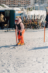 Child learning skiing at a winter ski resort