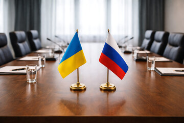 Empty Conference Table With Ukraine and Russia Flags Facing Each Other Editorial