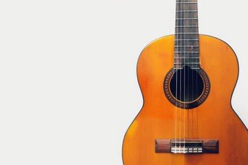 Obraz premium Classical Guitar's Serenity: A beautifully crafted classical guitar rests gently against a backdrop, its rich wood grain and intricate details offering a sense of calm and musical potential.