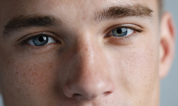 Blue Eyed Man Close Up Portrait Looking At Camera Confident Facial Features