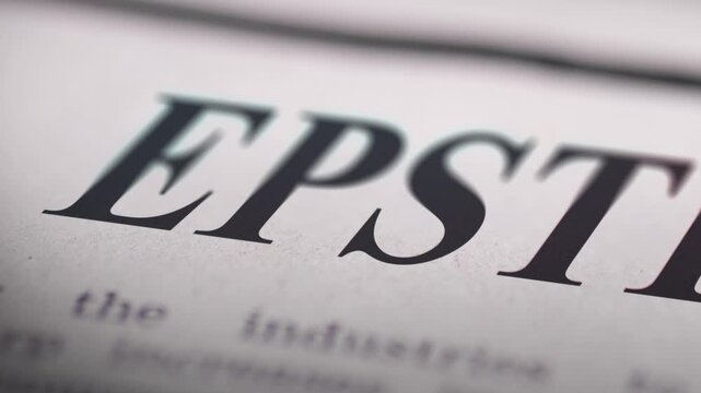 A slow, shallow focus panning video close-up on the "Epstein" headline in a newspaper, emphasizing the text