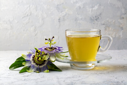 A cup of herbal tea with the herb passiflora caerulea. Alternative herbal medicine, calming and soothing effect
