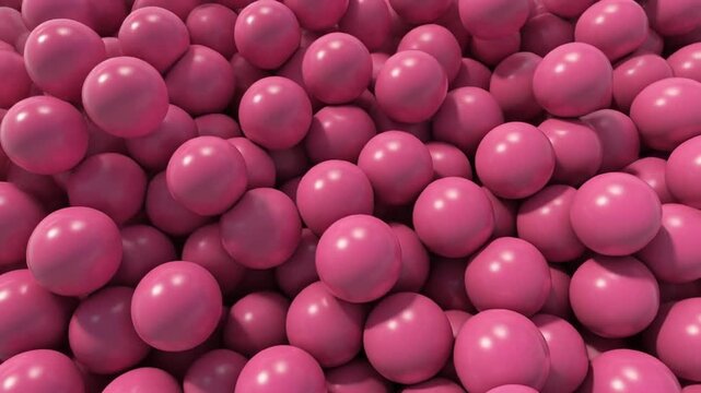 Large quantity of pink balls filling a container or space