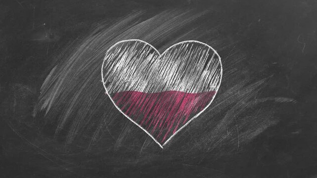 National flag of Poland in heart shape  drawn with colored chalk on a blackboard. Learning Polish.