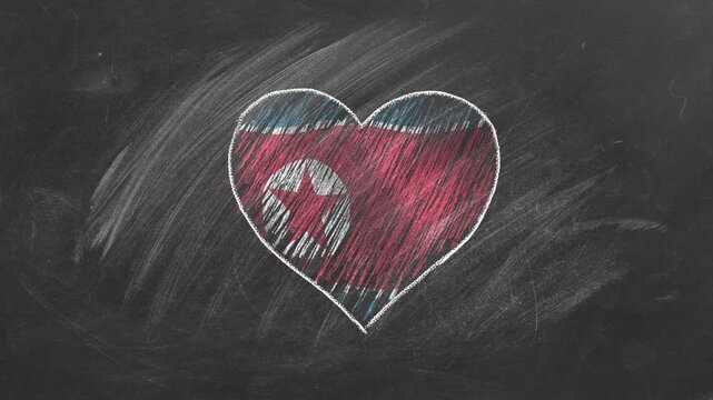 National flag of North Korea in heart shape  drawn with colored chalk on a blackboard.  Korean language, learning Korean.