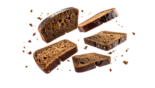 Dark rye bread slices with crumbs floating against a black background