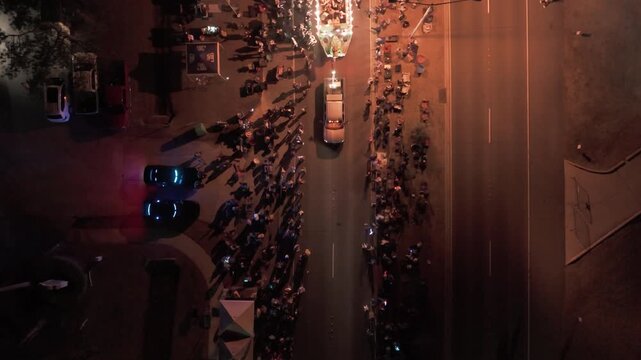 Overhead Aerial Drone Shot of Festive Louisiana Mardi Gras Float Surrounded by Spectators