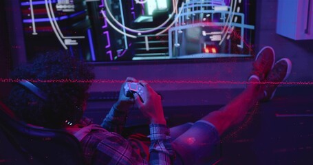 Reclining gamer holding gamepad in dim neon room facing HUD screen, wearing headset plaid shirt © vectorfusionart