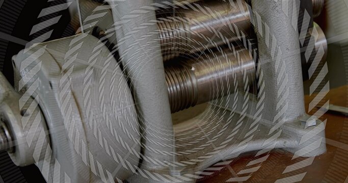 Focusing cast-iron bench vise revealing threaded lead screw on workbench, with chevron overlay