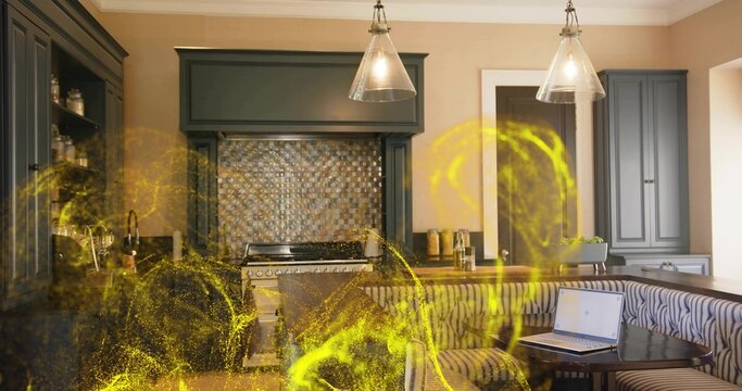 Featuring kitchen interior with range and hood, pendant lights, banquette with laptop, yellow wisps