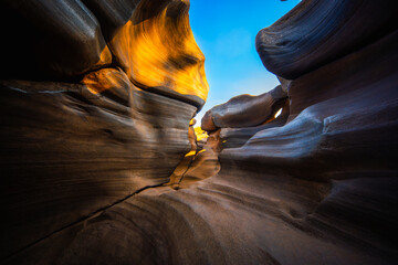 Narrow canyon rock formation sunlight blue sky natural landscape potholes erosion sandstone outdoor geological Lei Dan Stone Field Thailand