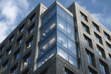 Obraz premium Modern office building corner with glass windows and brick exterior under cloudy sky, showcasing architectural detail and urban design in bright atmosphere