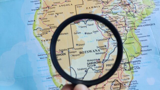 View of Botswana, on a geographic map of Africa, seen using a magnifying glass