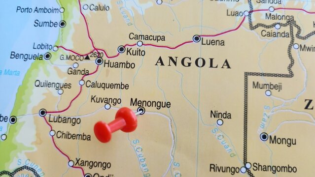 View of Menongue, formerly Serpa Pinto, is a municipality and the capital of Cubango Province in Angola, on a geographical map of Africa, marked with a red push pin.
