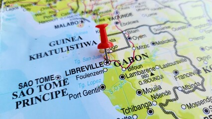 Naklejka premium View of Libreville, is the capital and largest city of Gabon, on a geographical map of Africa, marked with a red push pin.
