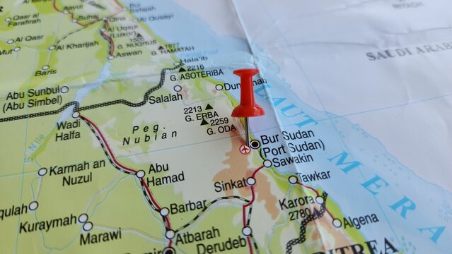 View of Port Sudan, is a major port city on the Red Sea in eastern Sudan, and the capital of Red Sea State, on a geographical map of Africa, marked with a red push pin.