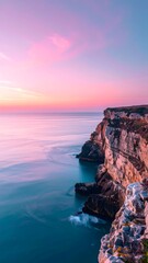 Coastal Serenity: Witness the serene beauty of a coastline bathed in the soft hues of dawn, where the majestic cliffs meet the tranquil sea, creating a harmonious panorama. 