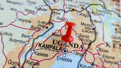 Naklejka premium View of Kampala, Capital and the largest city of Uganda, on a geographical map of Africa, marked with red push pin