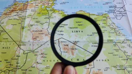 View of Libya, on a geographic map of Africa, seen using a magnifying glass