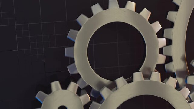 A slow-motion cinematic shot of various silver gears and cogs rotating in seamless motion against a dark background, representing teamwork and mechanical progress