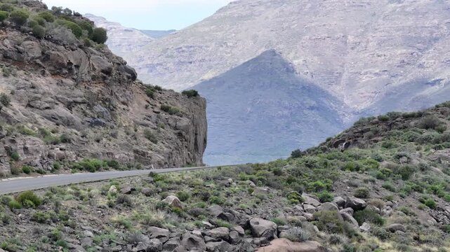 Aerial view of car driving along epic mountain roads in Lesotho, Africa