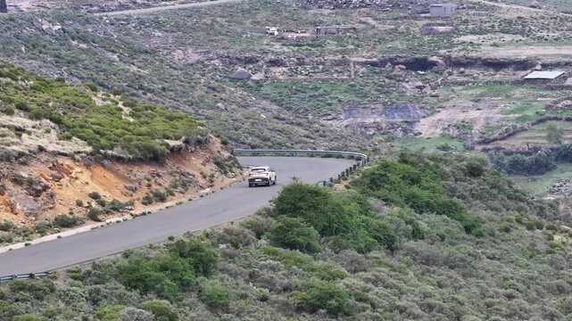 Aerial view of car driving along epic mountain roads in Lesotho, Africa
