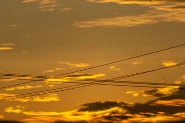 Naklejka premium silhouette of electric wire with beautiful sky at sunset background.