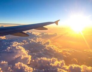 Fototapeta premium Aerial view of plane wing, flying above golden-lit clouds, near sunrise