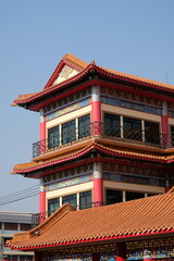 Fototapeta premium Traditional Chinese Pagoda Architecture with Ornate Details and Terracotta Roof Tiles