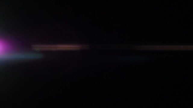 Cinematic Moving Light Flares Over Dark Background in Ultra-High Resolution with Dynamic Glow