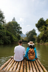 Experience serenity while bamboo rafting on the peaceful waters of Khao Sok in Surat Thani