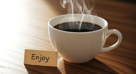 A steaming cup of black coffee with a small wooden sign that says enjoy