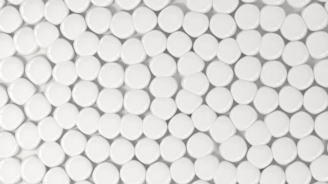 Seamless abstract background of smooth white pebbles gently moving and shifting pattern