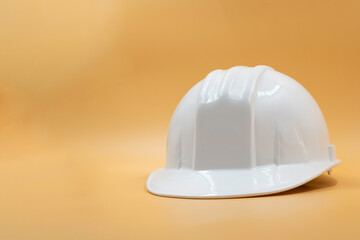 Fototapeta premium White Safety Helmet Isolated on Yellow Background