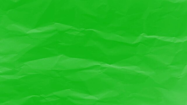 crumpled green paper texture background animation loop. wrinkled paper sheet background texture. abstract crumpled paper transition with chroma key