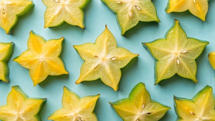 Naklejka premium Flat Lay Star Fruit Whole and Sliced Arrangement on Bright Summer Concept Background