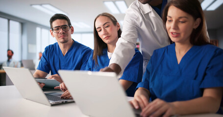 Naklejka na ściany i meble Medical Students Engage In Lesson With Healthcare Consultant