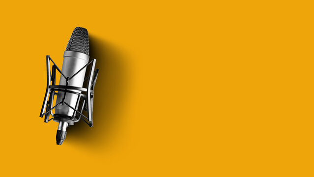 Podcast recording setup with microphone in studio against yellow background