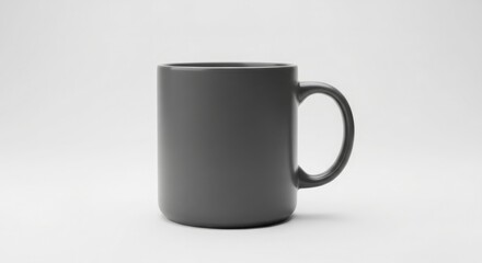Fototapeta premium A dark grey coffee mug with a handle on a white surface viewed from the side in a product photography style