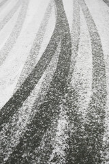 Winter road surface texture with snow and tire tracks