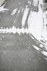 Winter road surface texture with snow and tire tracks