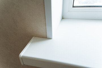 Clean White Windowsill Corner Detail With Rounded Edge, Smooth Finish And Sunlight Highlighting Surface, Modern Interior Trim And Protective Seal Visible In Highquality Build © Aleksey
