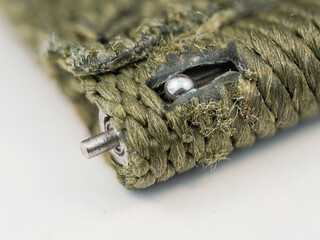 Macro view of the locking pin on a watch strap.